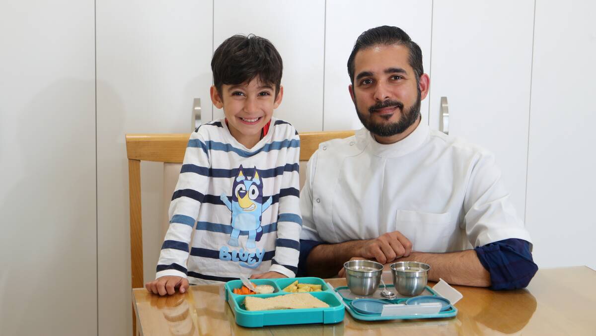Hidden sugars: Dr Mohit Tolani, with his son Khush, 4, is warning parents to avoid too many sugar-laden snacks in lunchboxes. Picture: Sylvia Liber 