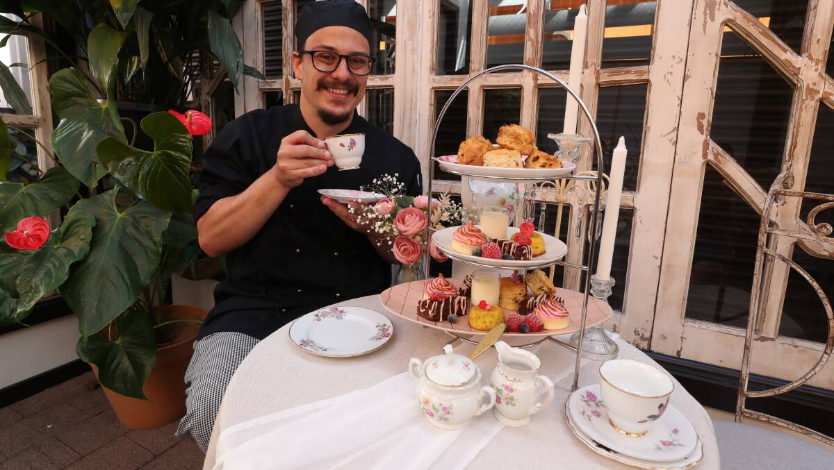 Sweet offering: Bray Moran with a high tea like the one Hideaway Lane is preparing for Valentine's Day. Picture: Robert Peet