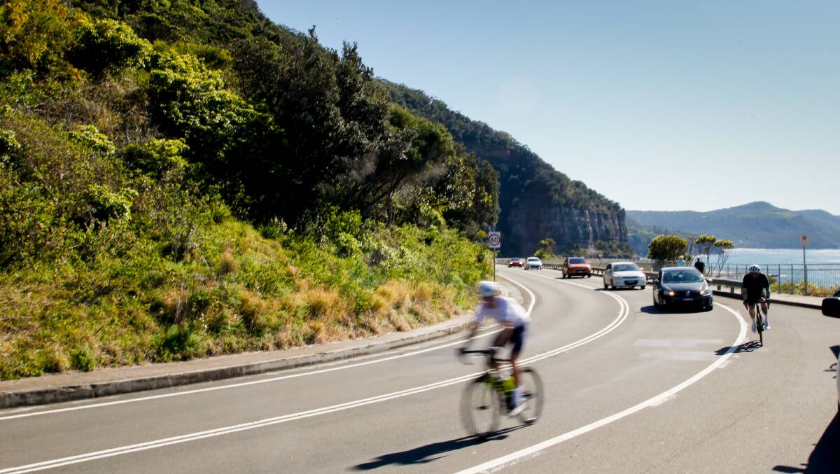 Sweet spot: A cyclist makes their way across Sea Cliff Bridge. Picture: Anna Warr