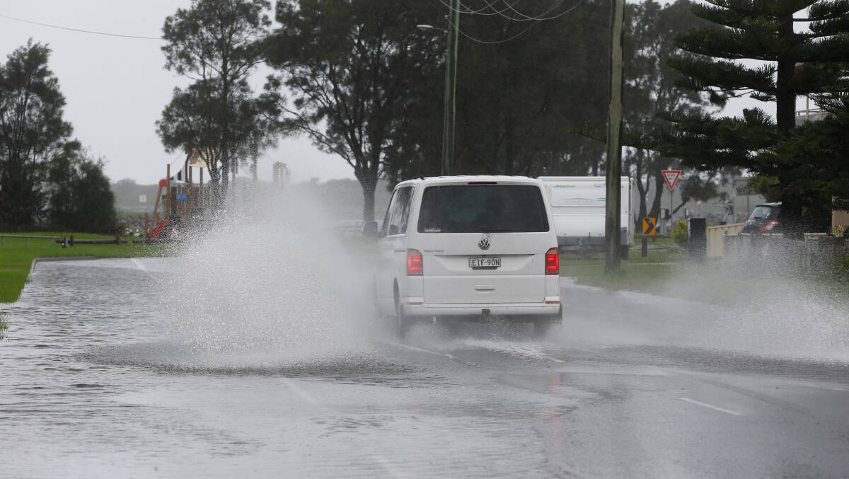 Take care: Heavy rain caused flash flooding in parts of the Illawarra yesterday. Picture: Robert Peet