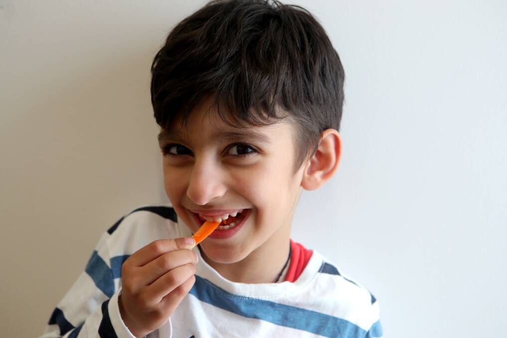 Crunch time: Dr Mohit Tolani is urging parents to pack snacks such as carrot sticks instead of sugary snacks. Picture: Sylvia Liber