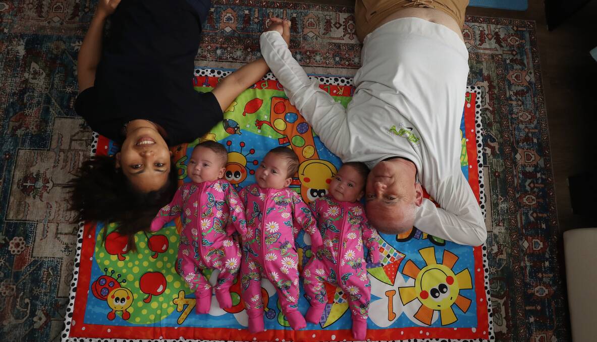 Flora Belle Polangco and Peter Stavropoulos with their triplets Isabella, Ariana and Maria-Alexa. Picture by Robert Peet