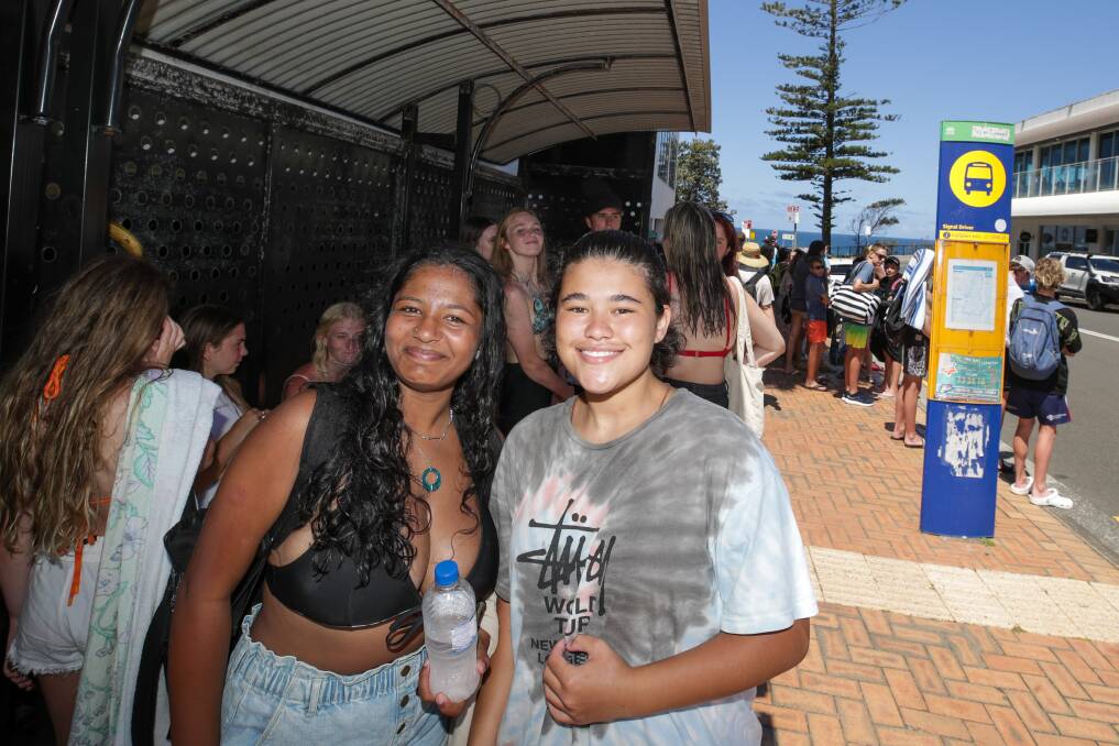 Thirlmere's Rheya Mason and Tahmoor's Mia Martin waiting for the Beach Bus. Picture by Adam McLean.