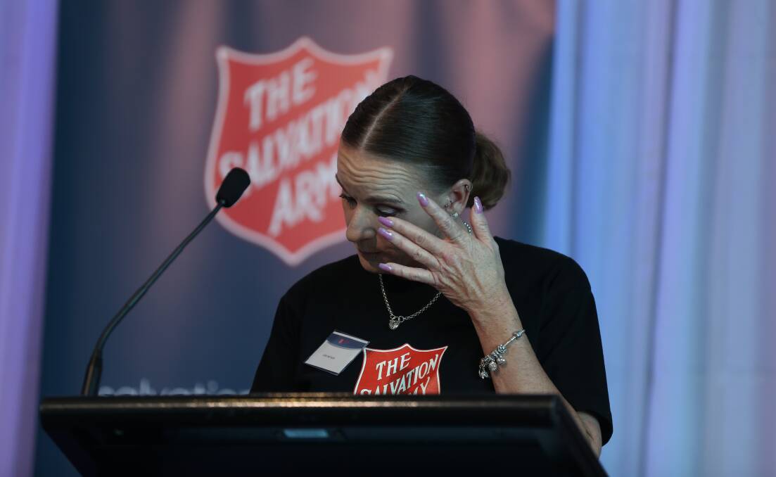 Julie Harrison wipes her eyes as she speaks at the Red Shield Appeal Launch. Picture: Robert Peet