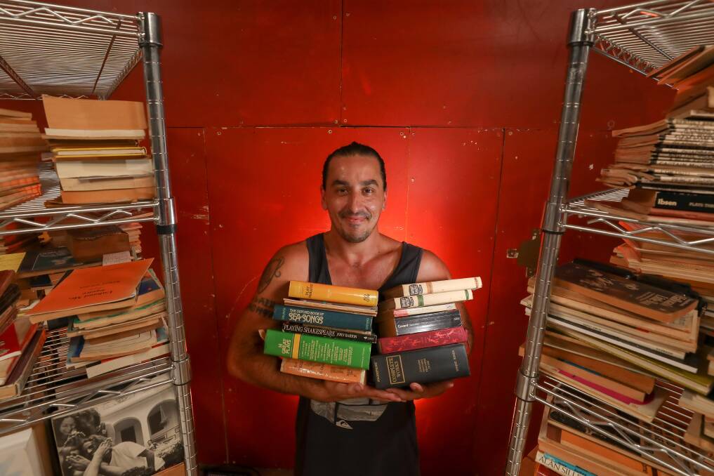 Adam O'Brien, founder and Creative Director of the Dire Theatre Company is collating the book collection of the late Gordon Streek into a drop-in library accessible to the public. Picture by Adam McLean.