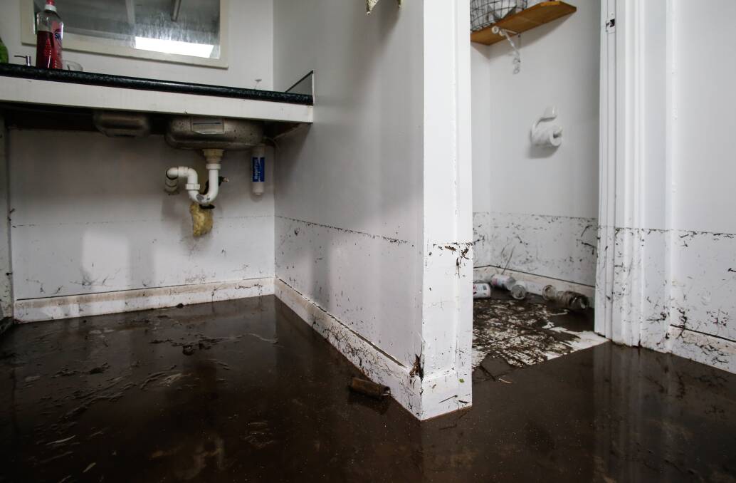 Clean-up: Owners and renters in the Illawarra are facing the fall-out of severe weather, after some homes flooded on Wednesday night. Picture: Anna Warr