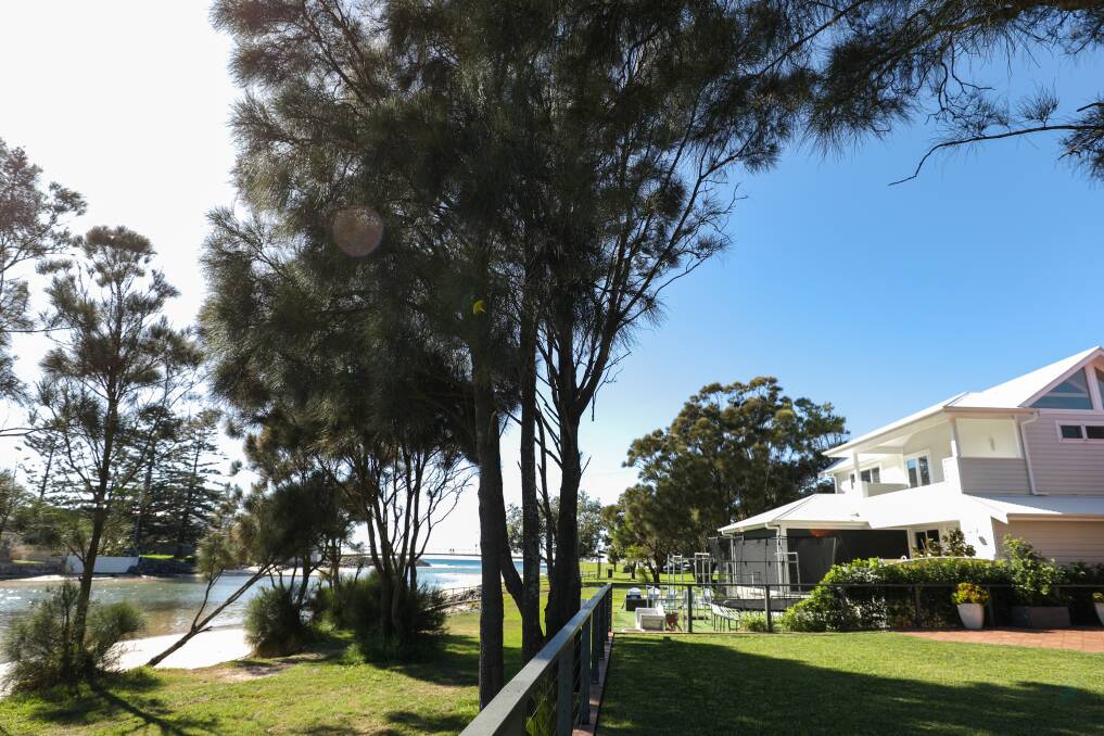 Homes like those along the foreshore in Barrack Point may not be affordable to insure in the near future. Photo: Adam McLean