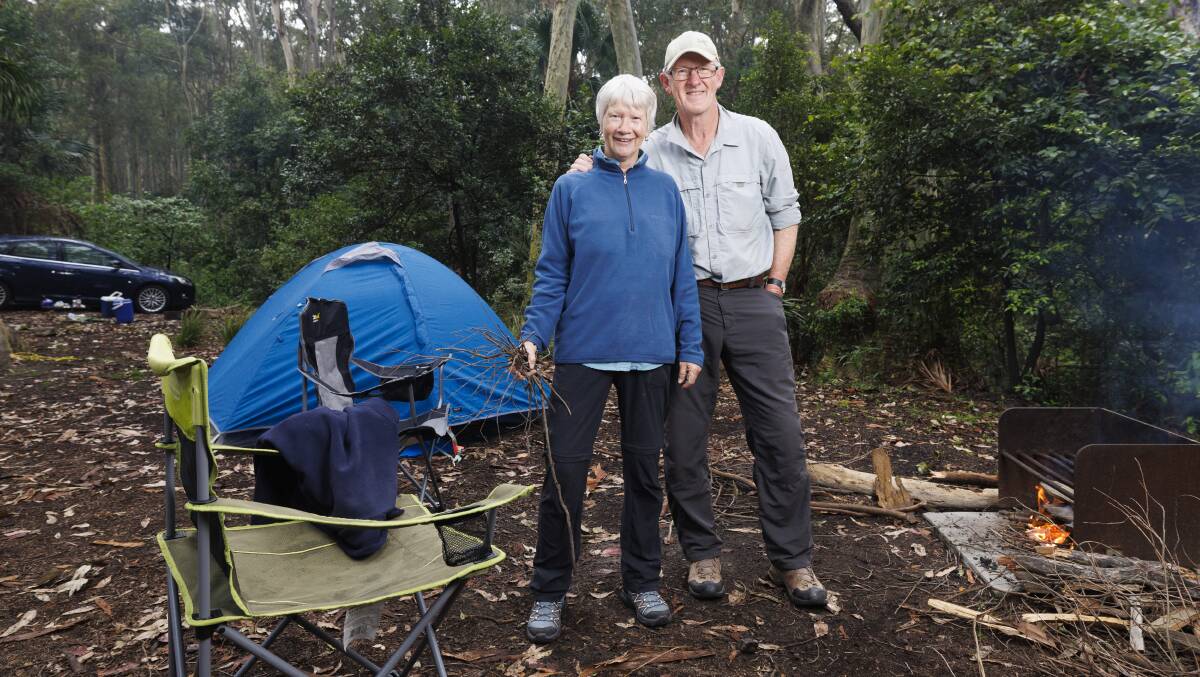 Lorna and John Reardon enjoying campfire at their favourite camp site - Depot Beach camping grounds. Picture by Keegan Carroll