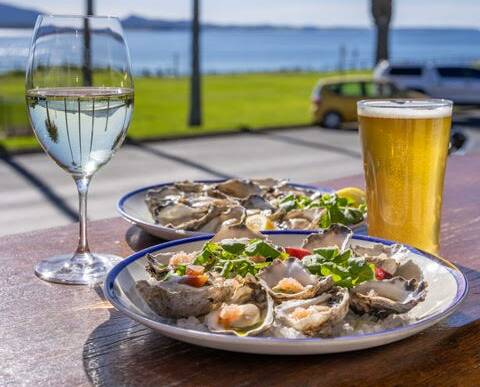 Enjoy a stunning plate of oysters with a chilled beer with a full view of the coast. Picture supplied