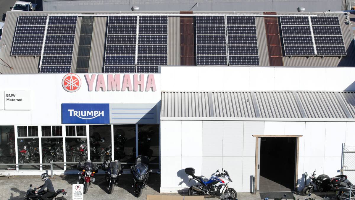 City Coast Motorcycles Wollongong installed 40 solar panels on their roof ten years ago. Picture: Adam McLean