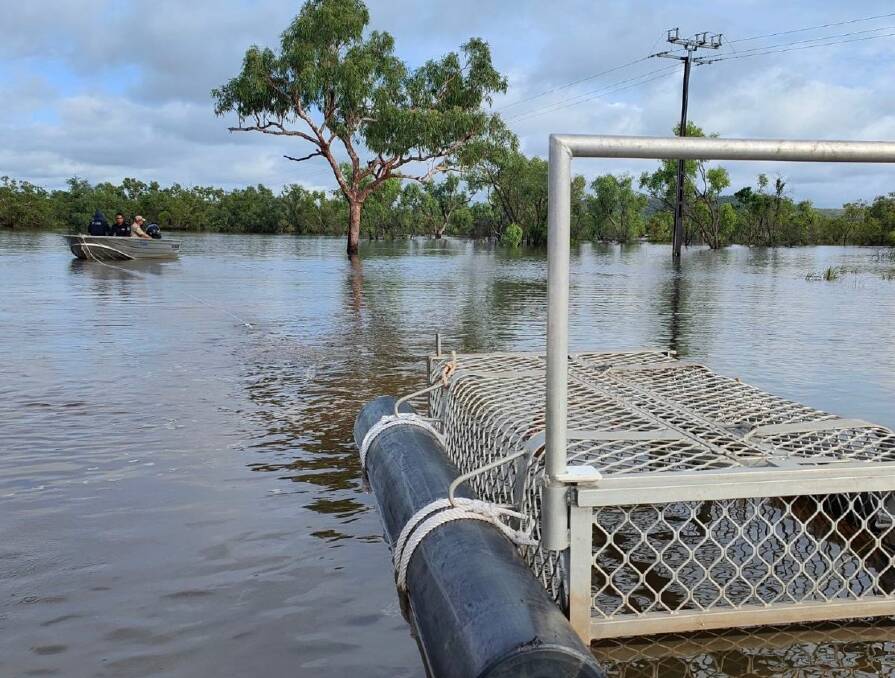 A croc trap has been places on the flooded Vic Highway near Timber Creek. Picture by Dominique Michel - via ABC. 