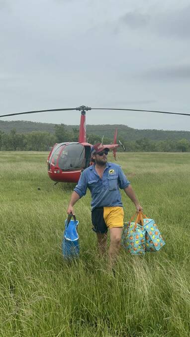 Tristram 'Potter' Holcombe had to get a helicopter and borrow a car to bring supplies into Timber Creek which is surrounded by floodwaters. 