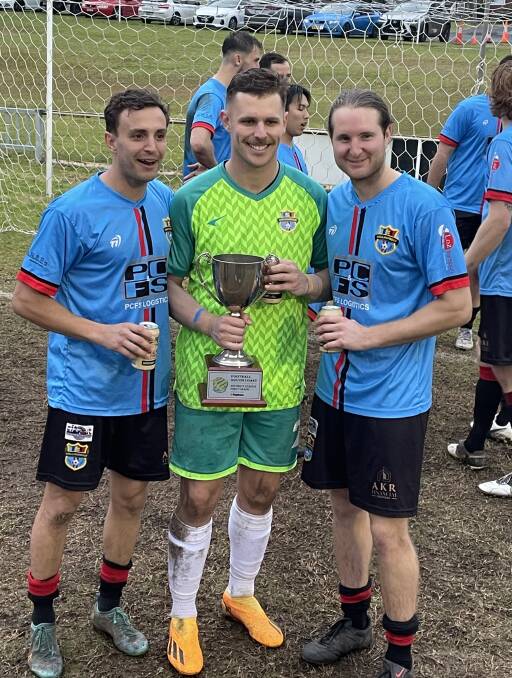 Shellharbour's Valentino Merxhushi, Blake Coad and Robbie Delbanco were in celebration mode following the win. Picture by Tracy Kidd