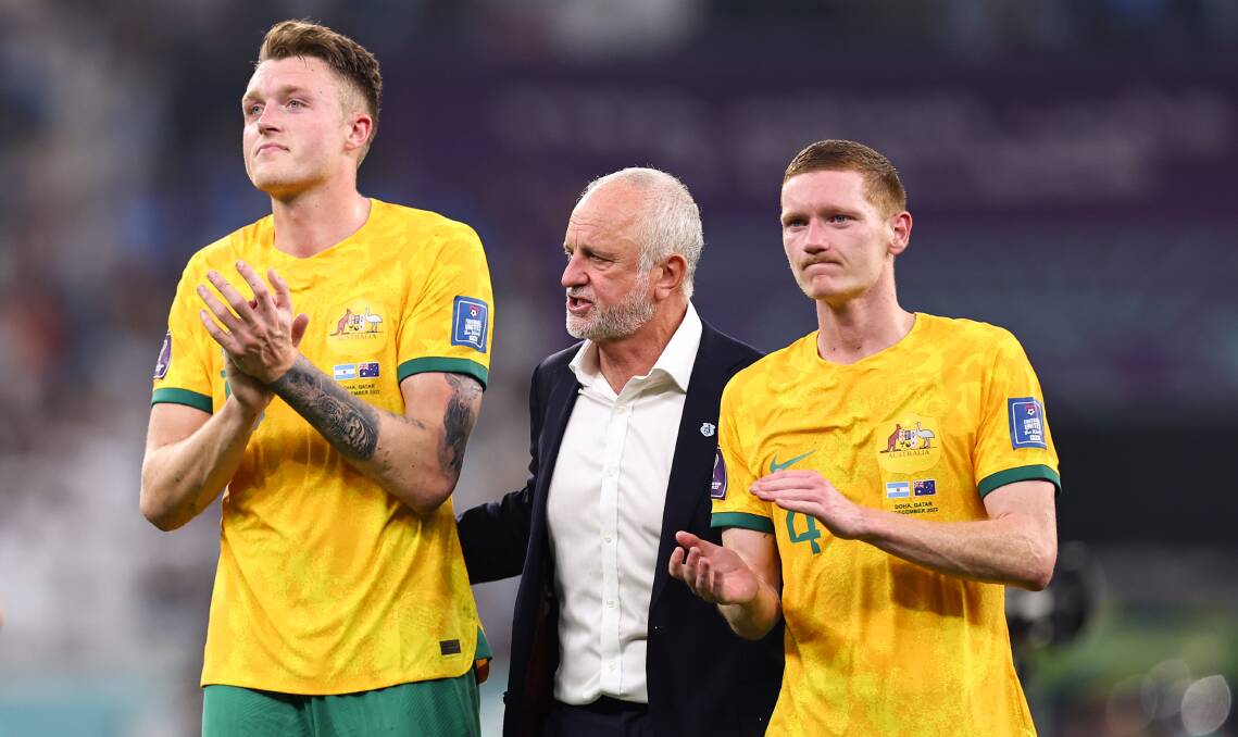 Graham Arnold with Kiama-born Kye Rowles (right) and Harry Souttar at the World Cup. Picture - Getty Images