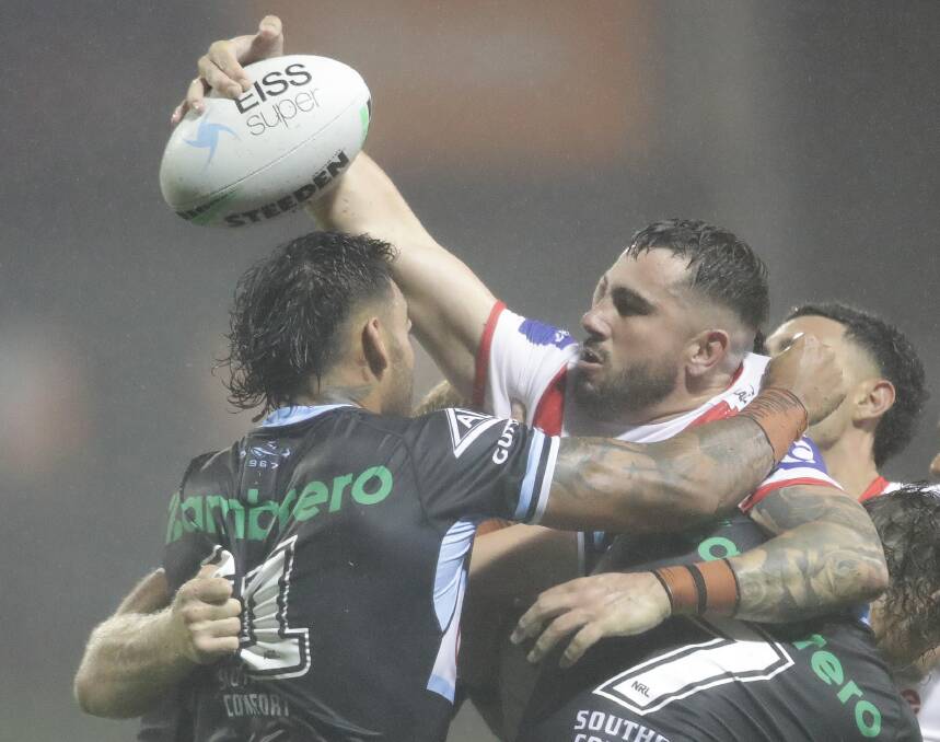 Utility: Jack Bird tries to get an offload away in their clash against the Sharks this season. Picture: Adam McLean