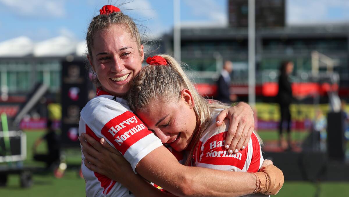 Mixed emotions: Kezie Apps and Emma Tonegato embrace after last season's grand final defeat. Picture: Albert Perez/Getty