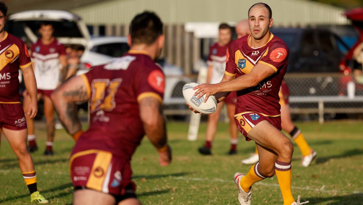 Shellharbour Sharks player Eze Harper looks to lay the ball off during his team's 24-4 win against Albion Park Oak Flats. Picture by Anna Warr