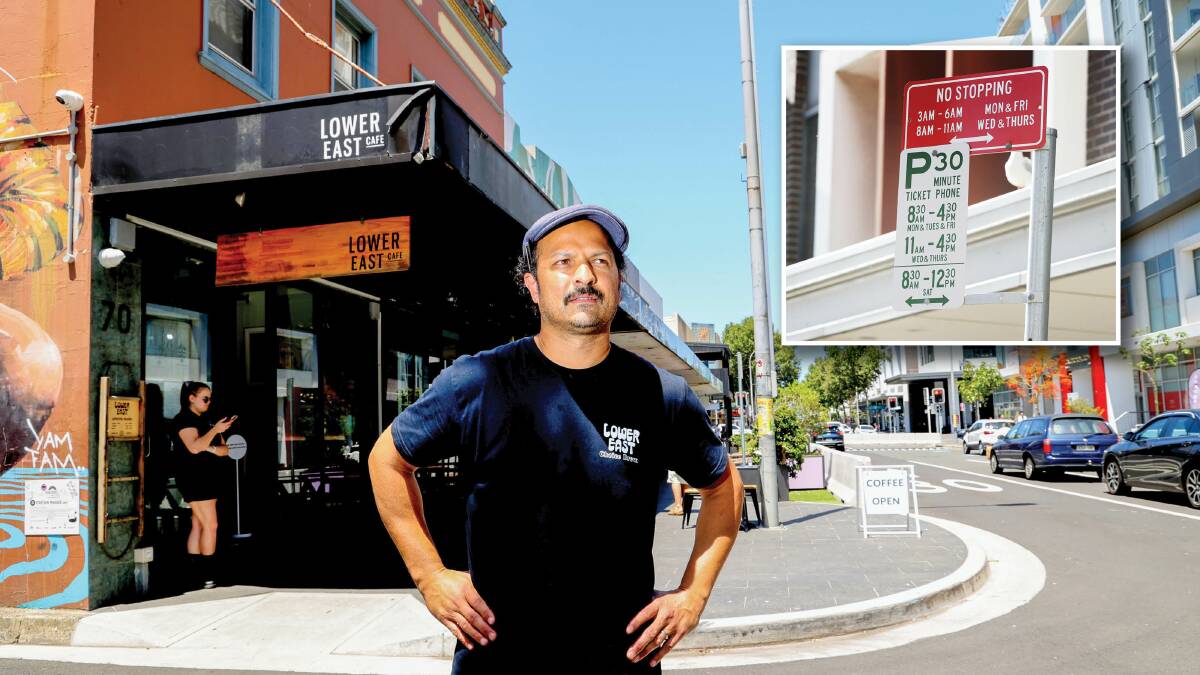 Lower East cafe owner Teesh Krishnayya outside his eatery. The cafe shared updated parking rules on social media. Main picture by Wesley Lonergan and parking sign picture by Robert Peet.
