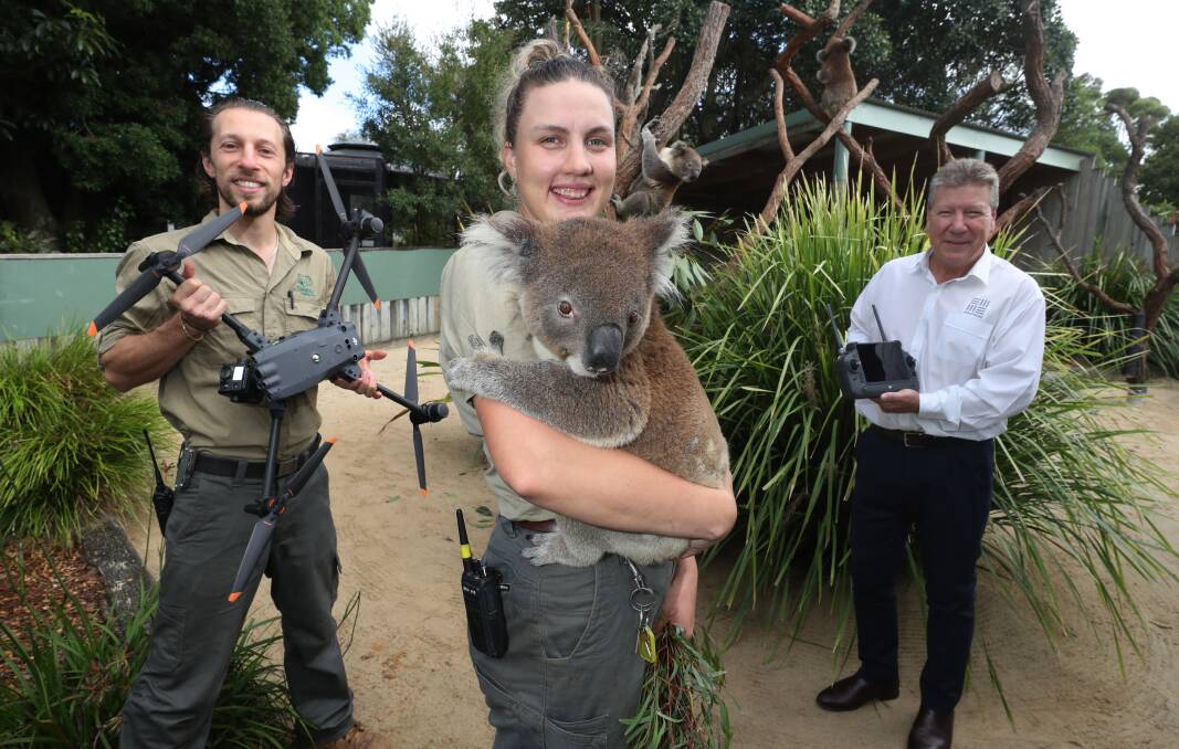 Jarrad Prangell and Zoe Ridge from Symbio and Peter Baker vice president operations South32 with koalas at Symbio. Picture by Robert Peet