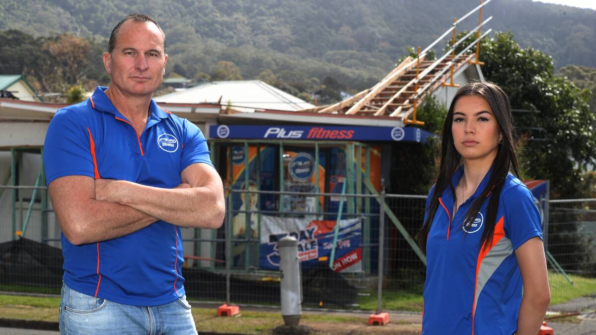 Rodd Parks and Lulu Lozano from Plus Fitness Thirroul standing outside the damaged building. Picture by Robert Peet