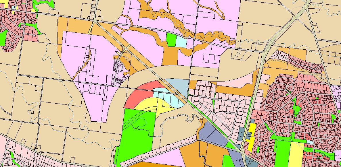 In planning for the Moss Vale Road Urban Release Areas between Bomaderry and Cambewarra Village the location of the bypass corridor was recognised and kept free from future residential development. The corridor is the brown band through the middle of the map, which was retained in a rural zone. Map supplied by Shoalhaven City Council.