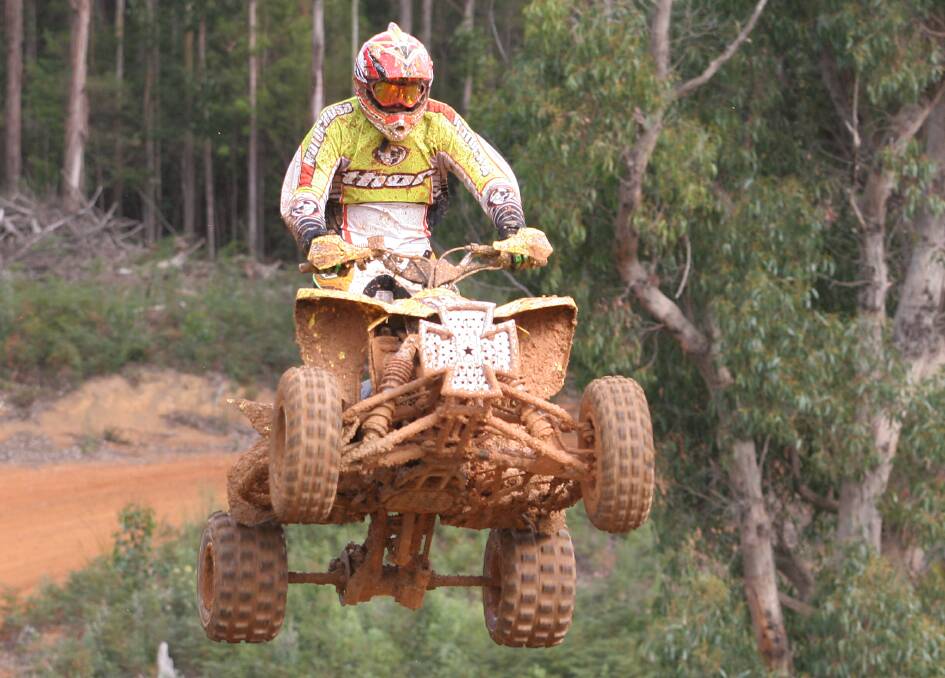 Devonport's Pascoe Burford flies over one a jump during a demonstration race at the Coastal Motocross Club meeting. File picture