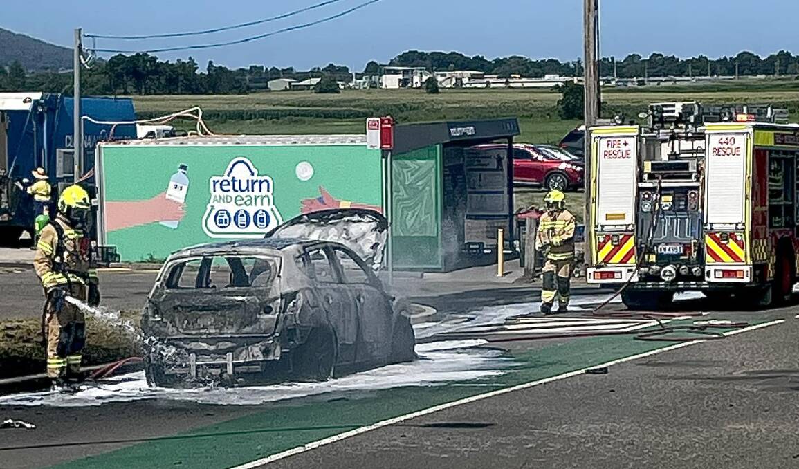 Fire and Rescue personnel extinguish a car fire in Nowra on Saturday. Picture supplied.