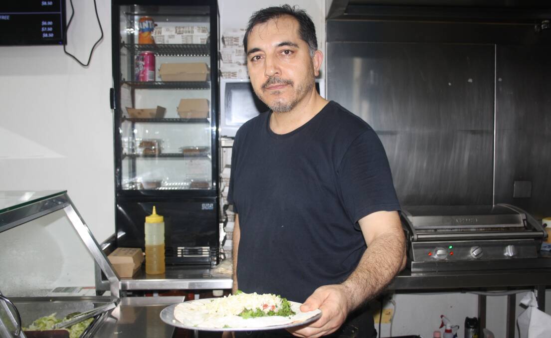 Ayhan Kaya is raising money for the Balsar family at is Bomaderry shop, Tasty Kebabs. Picture by Glenn Ellard.