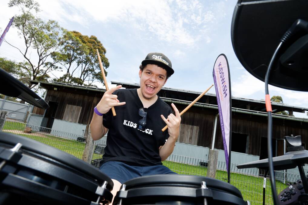 Dapto drummer Jamie Zahra-Skinner rocking out at KidsWish Christmas Party at Symbio Wildlife Park on December 7, 2023. Picture by Anna Warr
