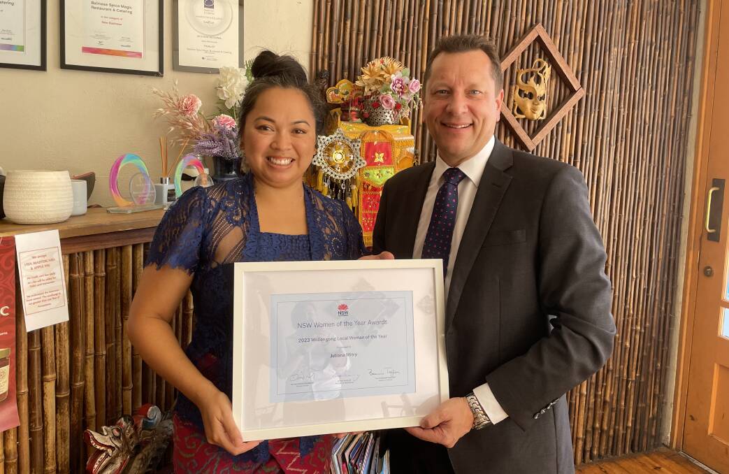 Paul Scully MP member for Wollongong presenting the Wollongong Local Woman of the Year Award to Jules Mitry, owner of Balinese Spice Magic restaurant. Picture by Marlene Even.