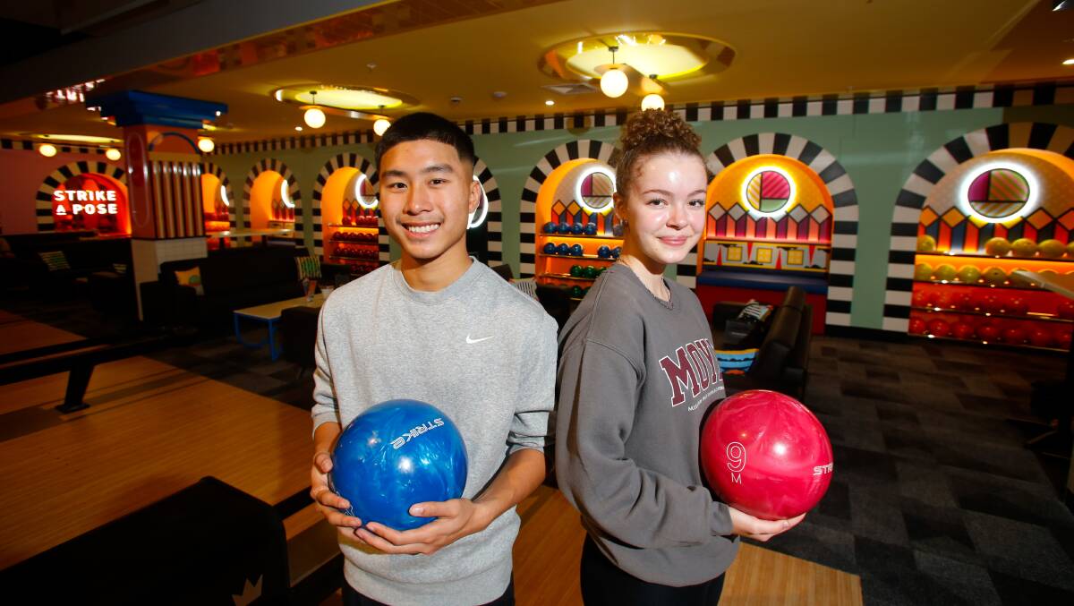 Mia Taylor and Zaidyn Phan about to bowl at the new Strike Bowling in Wollongong Central. Picture by Anna Warr