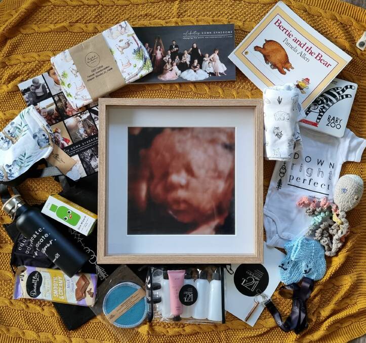 Rock Your Socks' helps to fund these hamper packs. Amy Gates photographed the hamper and her son's ultrasound image. Picture supplied by Stephanie Rodden.