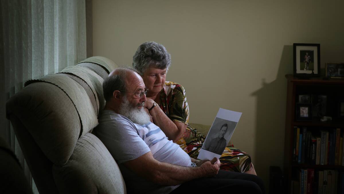 Gary Chinnock and his wife Jane hold a photo of Private Thomas Chinnock (Gary's grandfather). Picture by Sylvia Liber