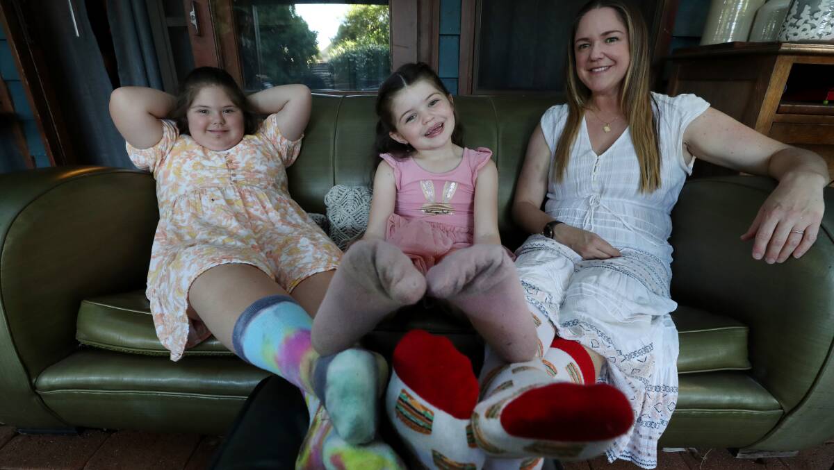  Jade Tonta, Wave FM Breakfast Show host, with daughters Lulu Tonta (age 9) and Arwen Tonta (age 5) show off their socks in preparation for the Rock Your Sock fundraiser on World Down Syndrome Day. Picture by Robert Peet.