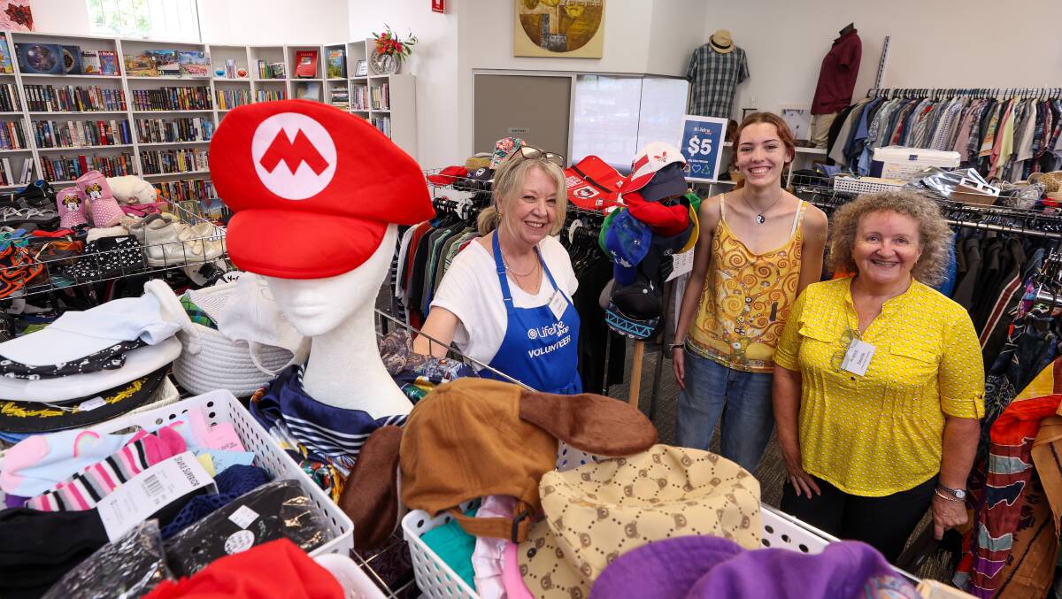 Volunteers Sandra Brown, Mikayla Finna and Imelda Laidler at the Dapto Lifeline store. Picture by Adam McLean