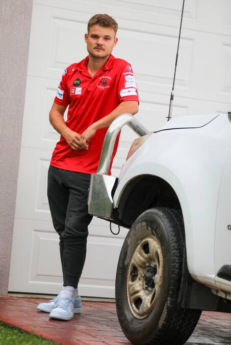 Keegan Matias standing next to his ute. The Port Kembla resident warned locals on Facebook to check their tyres are secure.