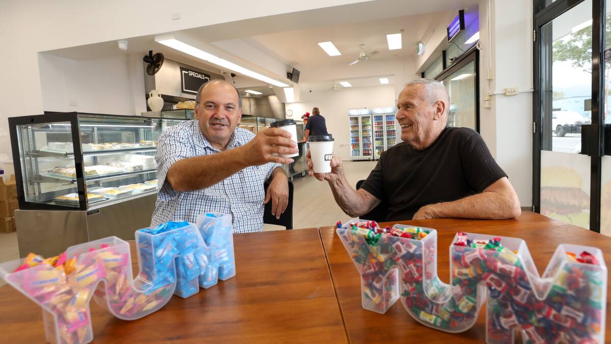 Cheers! Tony Gregoriou from Tony's Chicken Shop in Wollongong with long time customer Peter Zeidler. Tony re-launches the store on Monday, March 20 that he first opened in 1985. Picture by Adam McLean.