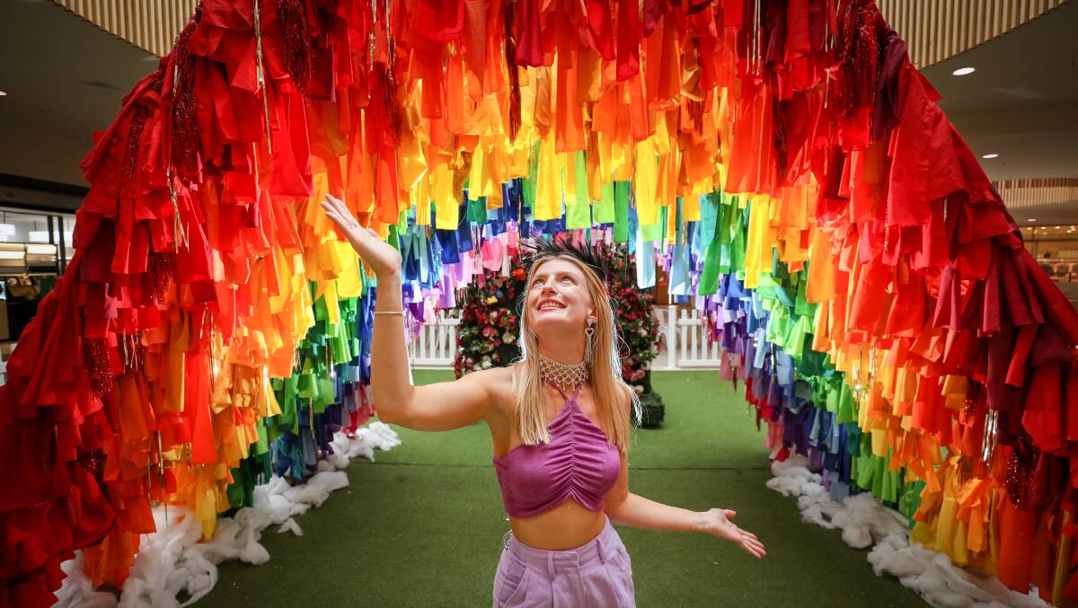 Katie Cornock with the rainbow display in GPT for World Pride. She took part in the Sydney Mardi Gras parade with the Shellharbour Shag Harders float. Photo by Adam McLean.