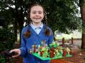 Avalon Jankowski, a student from Tarrawanna Public School holding her 'Wildife Alert' project which includes an alarm and a lego model .Picture by Sylvia Liber