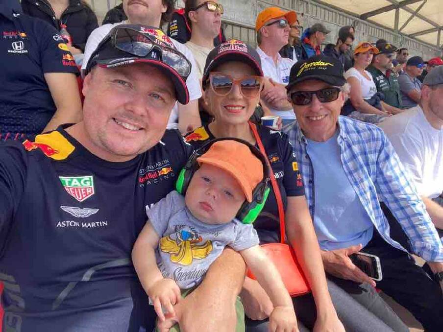 Louis with dad James, mum Amy and his Grandfather at the Australian GP. Picture from GoFundMe