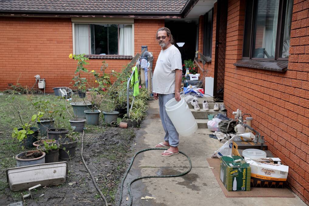 Anthony Wallis cleaning his yard on April 7. Picture by Sylvia Liber