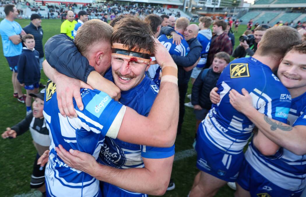 September 2. 2023 Butchers Captain Hayden Crosland embraces a team mate after their team's win in the Illawarra Rugby League grand final win against Collegians at WIN Stadium. 
