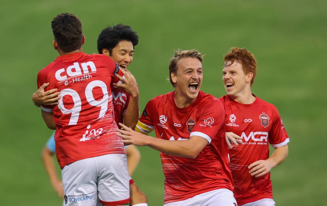 February 3. Wolves players celebrate a goal during their match against Apia at Win Stadium.