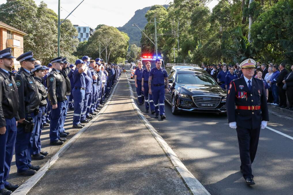 May 1: Emergency Services members line Northfields Avenue in a Guard of Honor after the funeral of Paramedic Steven Tougher at the University of Wollongong. 
