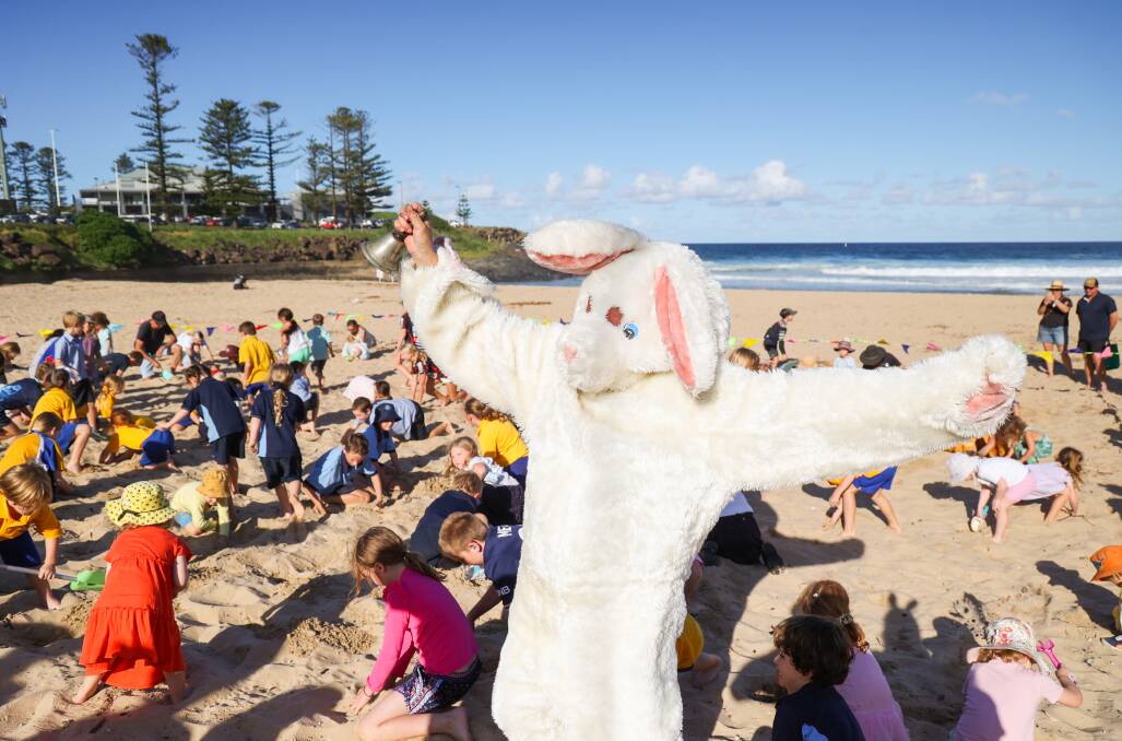April 5. Children search for a potato in the sand at Surf Beach Kiama in the annual Easter Spud Hunt. Potatoes were able to be exchanged for chocolate once they were found. 