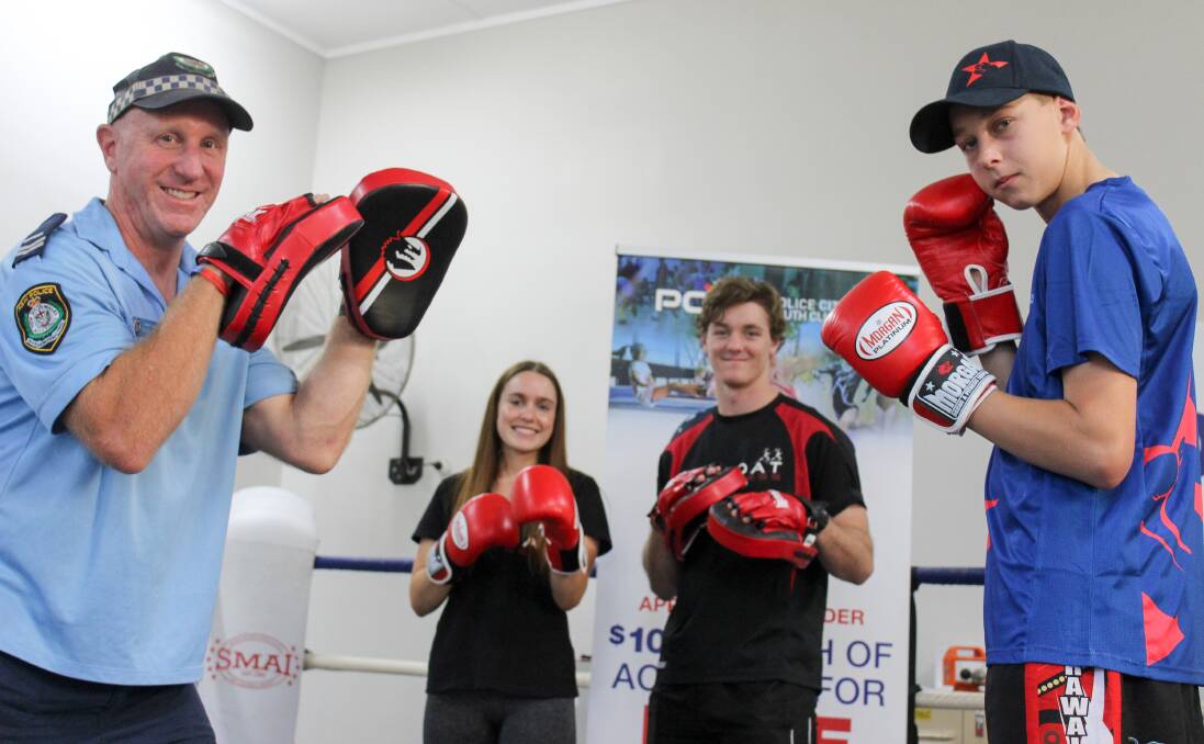 Glove on: Senior Constable Darren Palk, Chodat Gym trainer Kalen Campbell, Jack West and Fit for Life participant Daniel Wells. Picture: Ashleigh Tullis