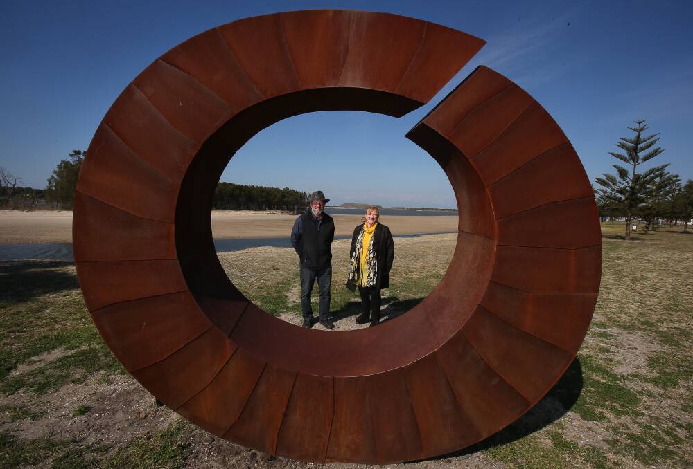 August 22:  Artist David Ball and Shellharbour mayor Marianne Saliba pose with a sculpture in Reddall Reserve, Lake Illawarra. David's artwork is to be a new addition to the Lake Illawarra Art Trail. Picture: Robert Peet