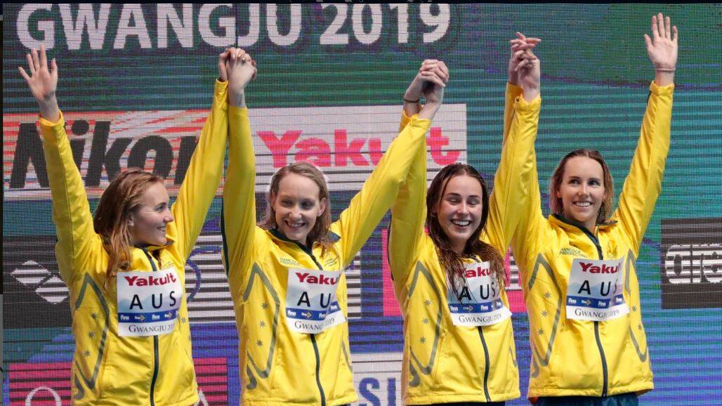 Australia's women's 4x200m freestyle relay team celebrate on the podium as they receive their gold medal at the World Swimming Championships. Picture: AP