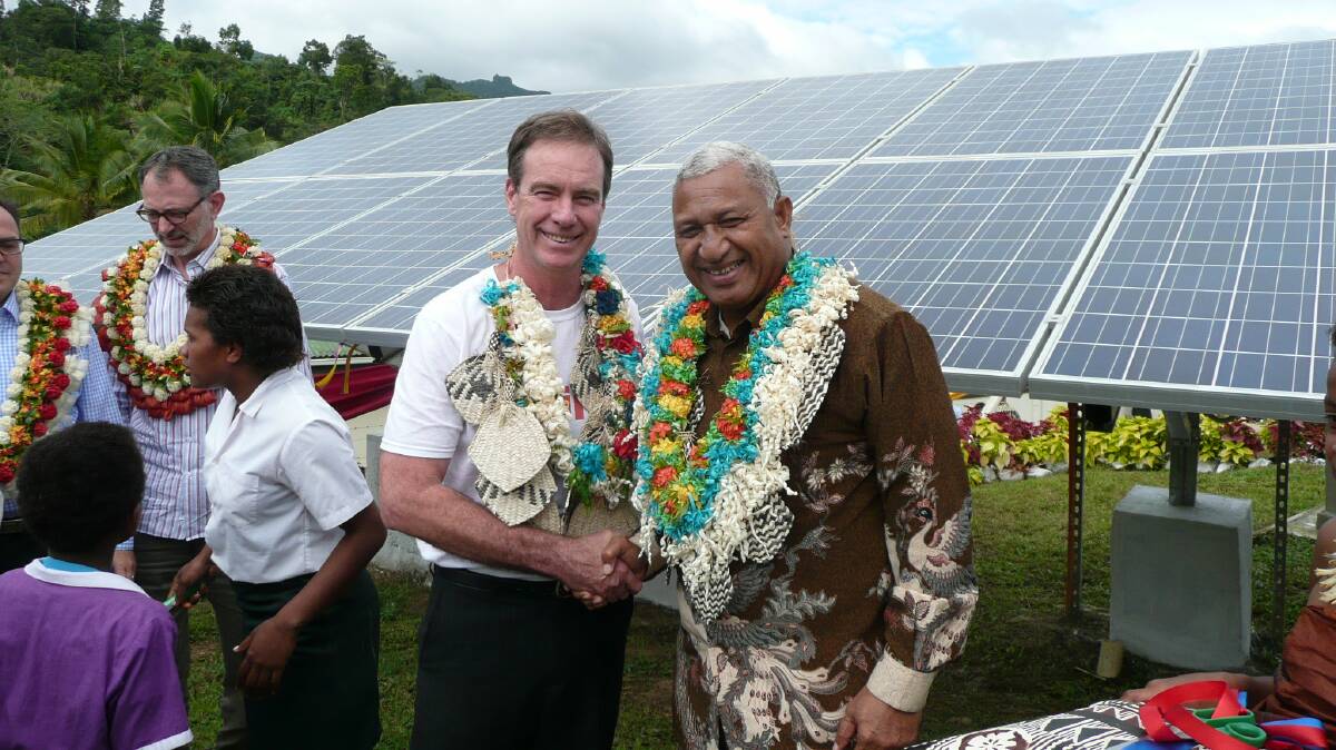 OAM RECIPIENT: Rob Edwards with Fiji Prime Minister Frank Bainimarama at the opening of an It's Time Foundation solar system at Wainimakutu High School.