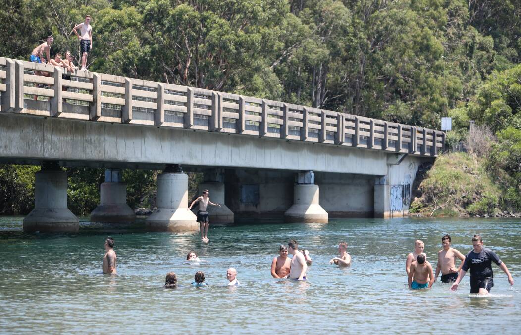 People cool off in the Minnamurra River with temps expected to nudge 40 degrees on Thursday. Picture: Adam McLean